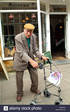old-man-with-a-zimmer-walking-frame-AEWW1E.jpg